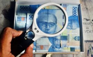 Ilustrasi kasus penyelidikan penipuan money game atau skema ponzi.